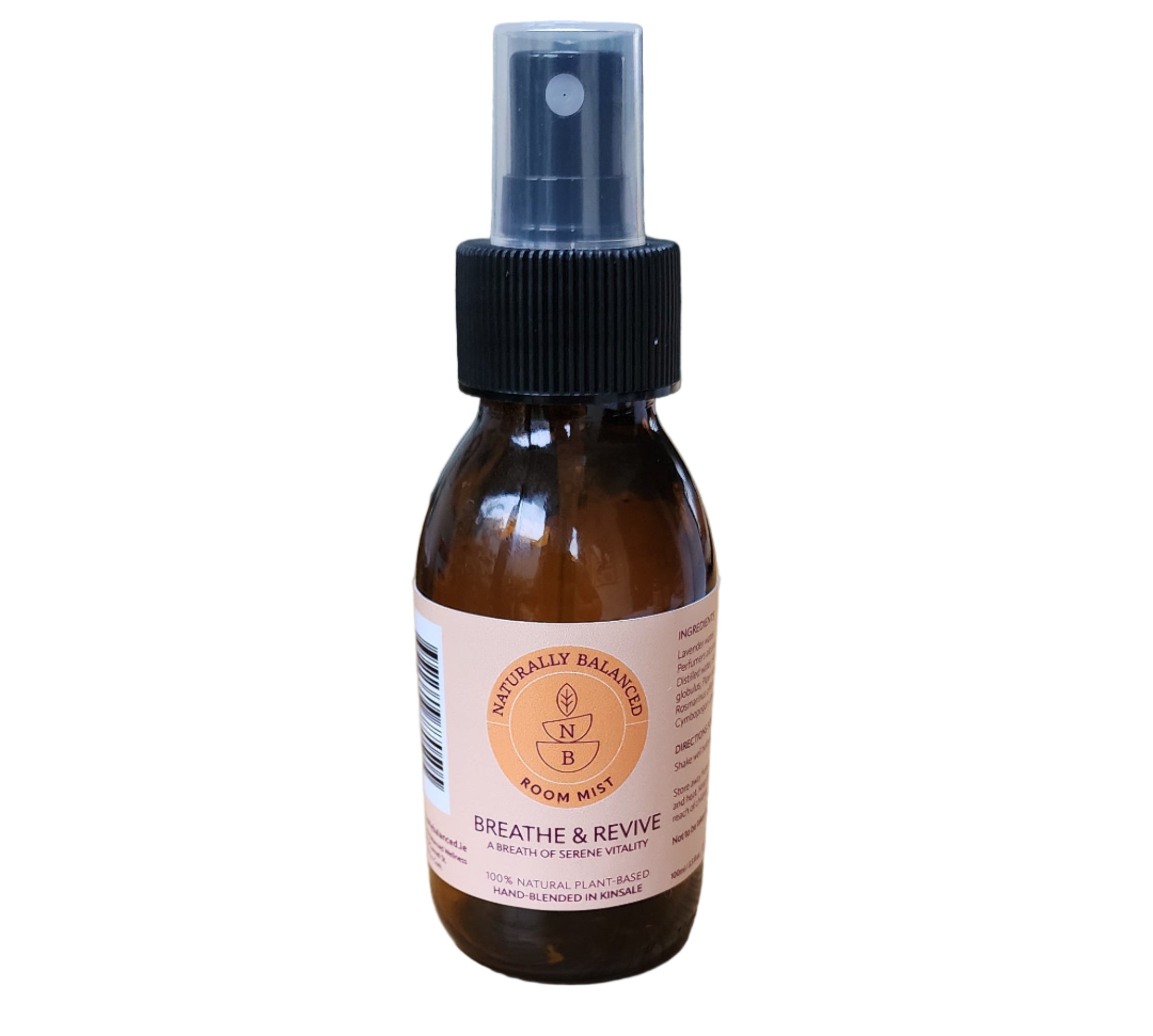 Brown spray bottle with a label on a wooden surface