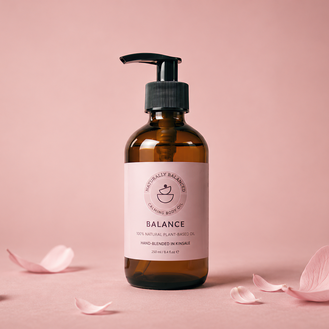 Cosmetic bottle labeled 'Balance' with pink petals on a pink background