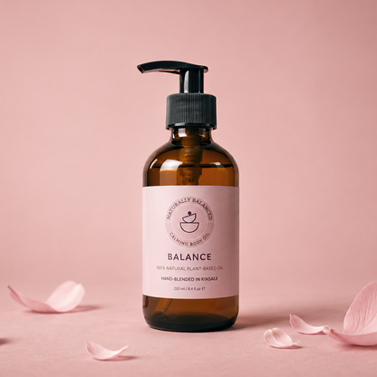 Cosmetic bottle labeled 'Balance' with pink petals on a pink background