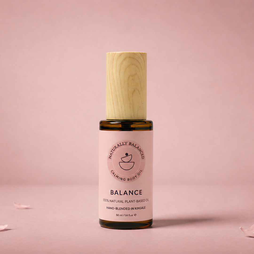 Bottle of 'Balance' with wooden cap on a pink background
