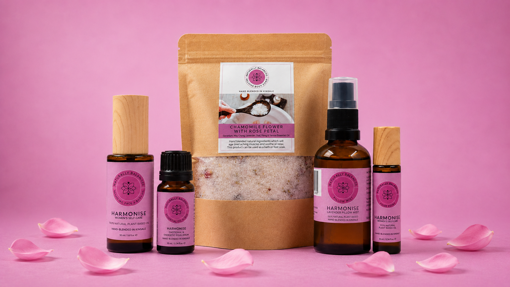 Harmonise skincare products on a pink background with rose petals.