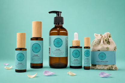 Collection of natural skincare products on a teal background
