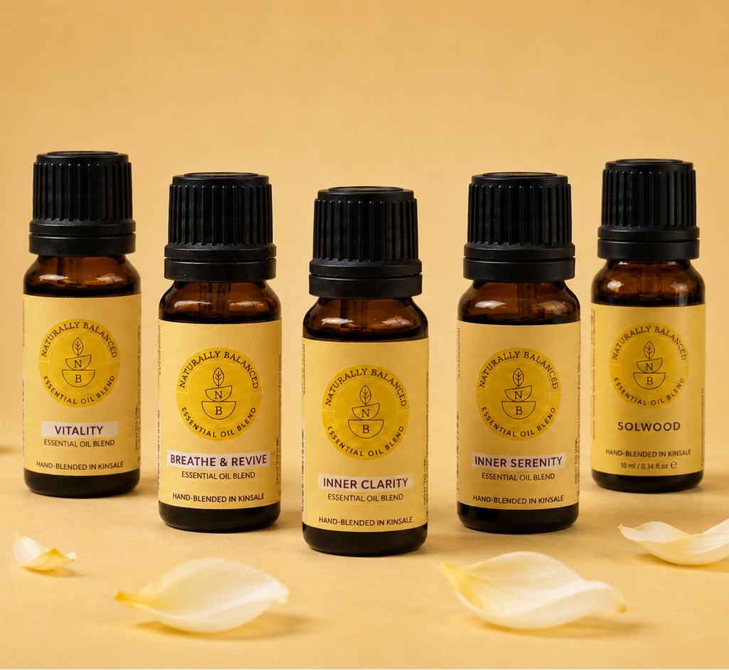 Set of essential oil bottles with labels on a beige background