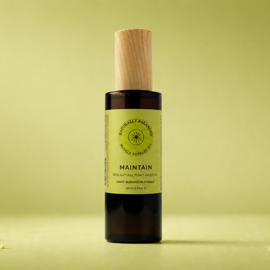 Bottle of 'Maintain' with a wooden cap on a light green background