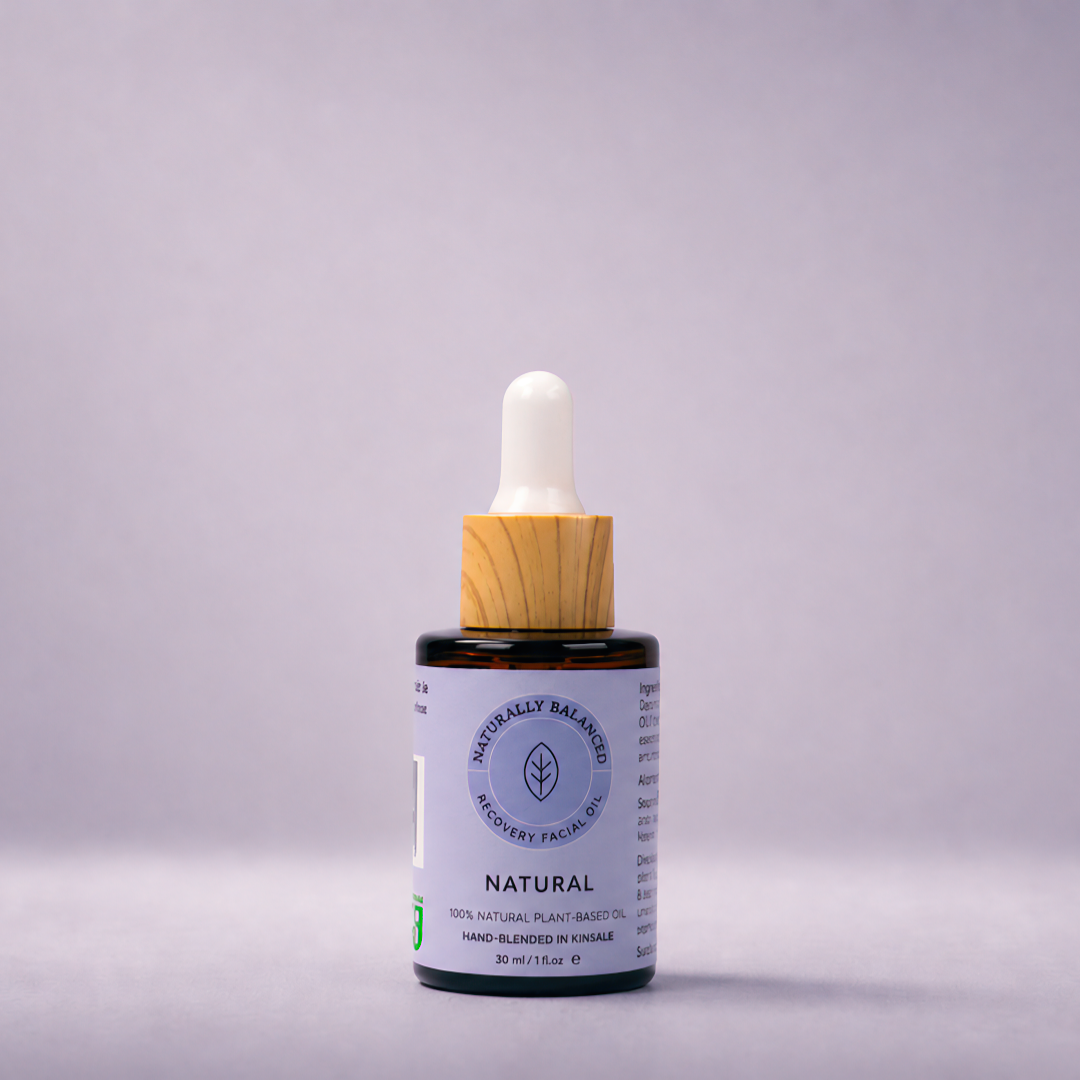 Bottle of natural skincare product with dropper on a gray background
