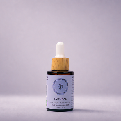 Bottle of natural skincare product with dropper on a gray background