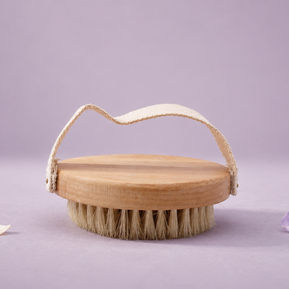 Wooden brush with a handle on a light purple background