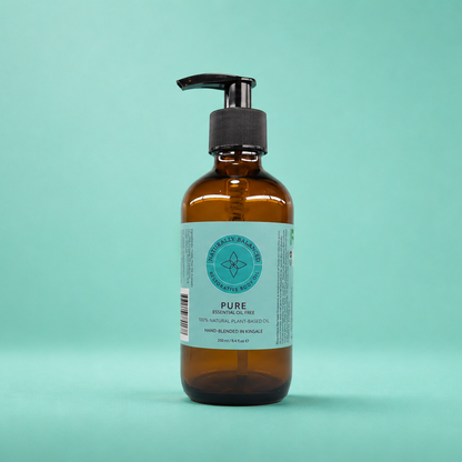 Brown bottle with pump on a light green background