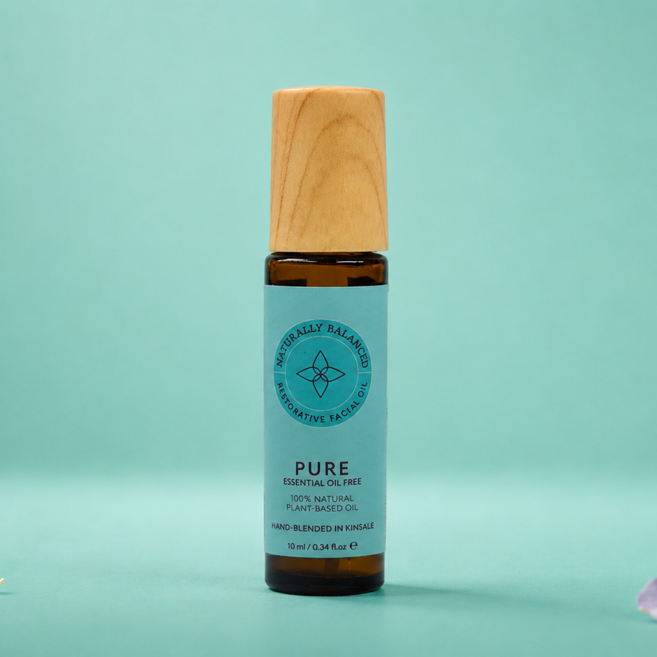 Skincare bottle with wooden cap on a light green background