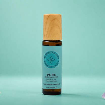 Skincare bottle with wooden cap on a light green background
