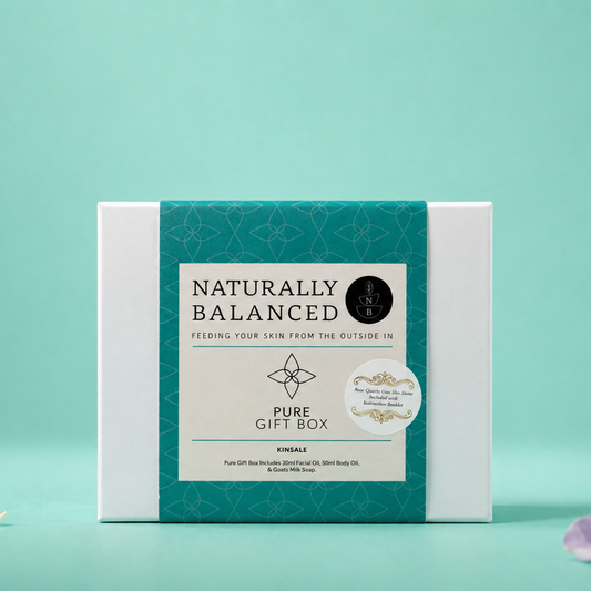 Naturally Balanced pure gift box on a teal background with decorative elements.