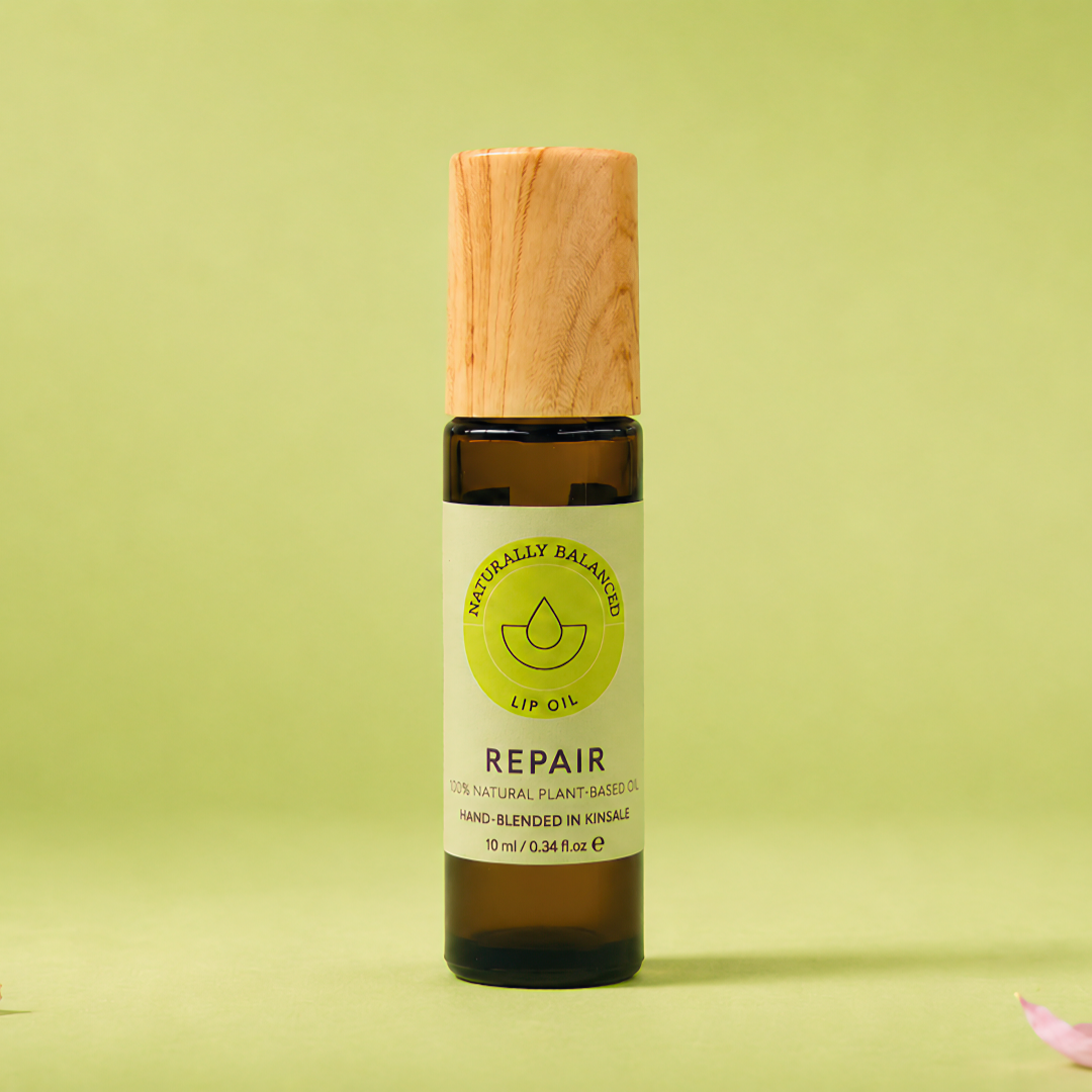 Bottle labeled 'Repair' on a light green background with pink petals
