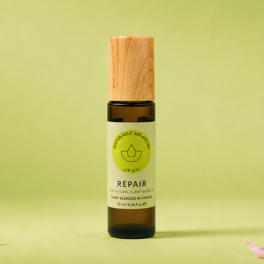 Bottle labeled 'Repair' on a light green background with pink petals