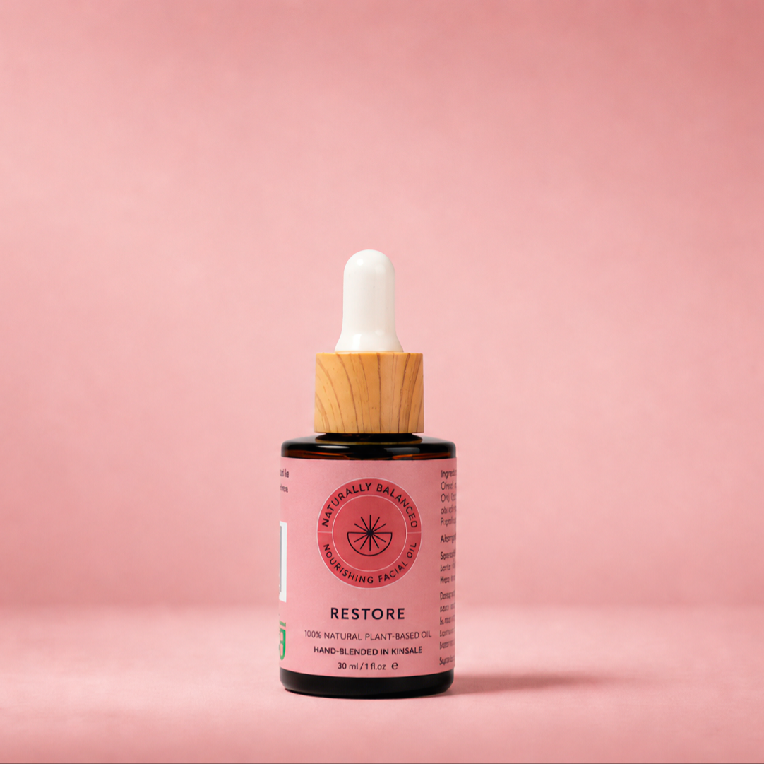 Cosmetic dropper bottle with pink label on a pink background
